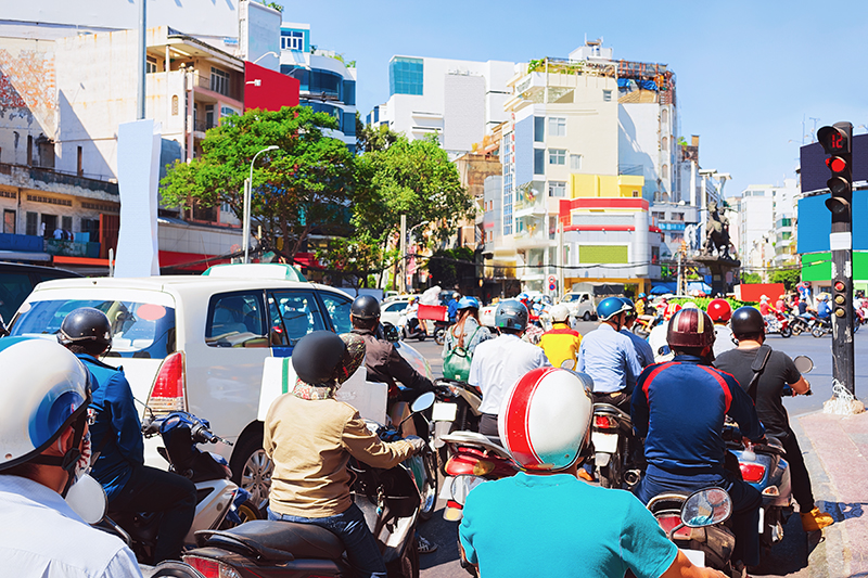 People on Scooters and motorcycles in the street of Ho Chi Minh City, Vietnam